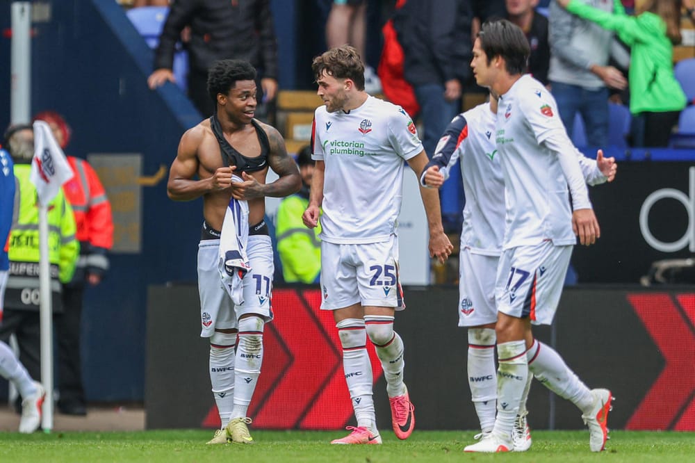 3FGD888 12th September 2026; Toughsheet Community Stadium, Bolton, Greater Manchester, England; Championship Football, Bolton Wanderers versus Cardiff City; Thierry Gale of Bolton Wanderers celebrates with teammates after scoring in the 90th minute to make the score 1-0