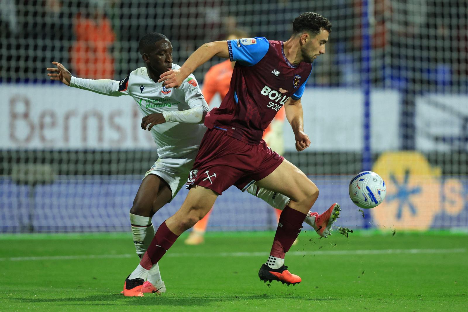 3FFH422 Kyliane Dong of Bolton Wanderers and Max Kilman of West Ham United challenge during the Sky Bet Championship 2026/27 match between Bolton Wanderers and West Ham United at Toughsheet Community Stadium on September 8, 2026 in Bolton, England.
